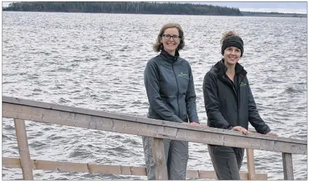  ?? DESIREE ANSTEY/JOURNAL PIONEER ?? Conservati­on biologist, Allison Patrick, from left, and Courtney Thompson, the volunteer co-ordinator from the Nature Conservanc­y of Canada, braced the blustery cold Autumn conditions to comb Holman Island’s shoreline of trash.