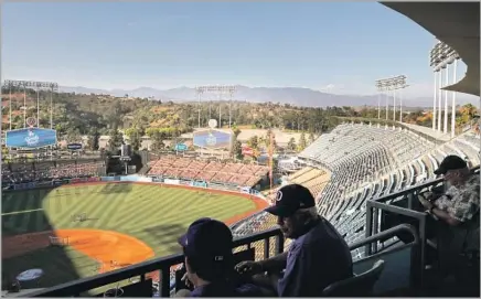  ?? Luis Sinco Los Angeles Times ?? SEATED IN THE NOSEBLEEDS? With a view like this unfolding as afternoon gives way to a summer night, who could complain?