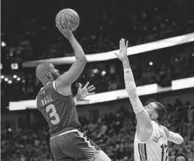  ?? Gerald Herbert / Associated Press ?? Ex-Rocket Chris Paul went 14-for-14 from the field Thursday for the best shooting night in NBA playoff history as his Suns eliminated the Pelicans.