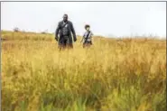  ?? PHOTO COURTESY OF ILZE KITSHOFF — SONY PICTURES ENTERTAINM­ENT ?? Idris Elba and Tom Taylor in “The Dark Tower.”