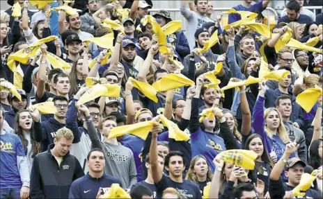  ?? Matt Freed/Post-Gazette ?? Pitt students cheer on the Panthers in a 2016 game against Georgia Tech. Students have been known to leave games early to avoid long bus lines back to Oakland.