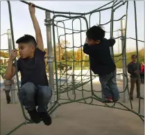 ??  ?? Sherwin Bacalso, left, 10, plays with his brother Allister, 4, at the Rotary PlayGarden in San Jose. Sherwin receives regular therapy sessions at Via Services, a support group that offers a monthly night respite night for parents of special needs...