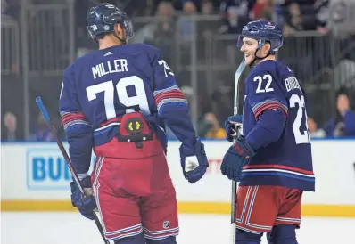  ?? SETH WENIG/AP ?? The Rangers’ Jonny Brodzinski (22) reacts after scoring during the second period of Sunday’s game against the Islanders in New York. The Rangers won 5-2.