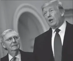  ?? Getty Images/tns ?? U.S. President Donald Trump, right, speaks to the press alongside Senate Majority Leader Mitch Mcconnell as he arrives on Capitol Hill on March 26 before joining Senate Republican­s for lunch in Washington, D.C.