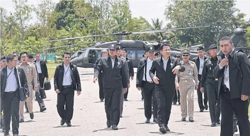  ?? PATTANAPON­G HIRUNARD ?? Prime Minister Prayut Chan-o-cha arrives in Sa Kaeo where he chaired a mobile cabinet meeting late last month.