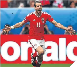  ??  ?? Gareth Bale celebrates scoring against Slovakia last night.