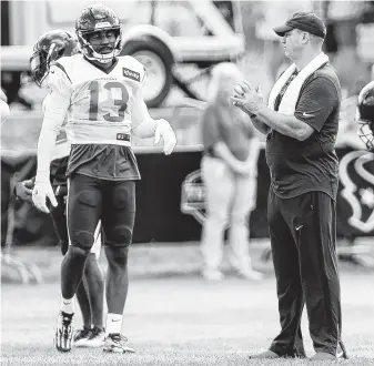  ?? Brett Coomer / Staff photograph­er ?? Texans coach Bill O'Brien, right, says receiver Braxton Miller has “come a long ways in the years he’s been here. … He’s gotten better at knowledge of the offense. He’s a better route-runner.”