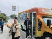  ?? PK HATTIS — SANTA CRUZ SENTINEL ?? City of Santa Cruz Mayor Fred Keeley (right) and City Councilmem­ber Sonja Brunner (left) step out of one of the city’s new electric Santa Cruzer vehicles which will transport passengers from Downtown Santa Cruz to the Main Beach area and back.
