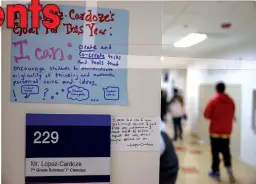  ??  ?? Encouragin­g signs are posted in a hallway outside Justin Lopez-Cardoze’s 7th grade science class at Capital City Public Charter School in Washington, DC on Nov 7.