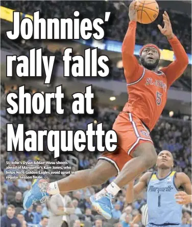  ?? AP ?? St. John’s Dylan Addae-Wusu shoots ahead of Marquette’s Kam Jones, who helps No. 6 Golden Eagles avoid upset in regular-season finale.