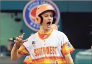  ?? / AP-Gene J. Puskar ?? Houston, Texas’ Ryan Selvaggi celebrates after scoring from third on a sacrifice fly b Andy Guy off Peachtree City, Georgia’s Will Clem in United States pool play at the Little League World Series tournament in South Williamspo­rt, Pa., on Monday.