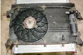  ??  ?? The air conditioni­ng fan is very 1 rough and partially seized, while the condenser radiator has become flaky and powdery with aluminium corrosion.