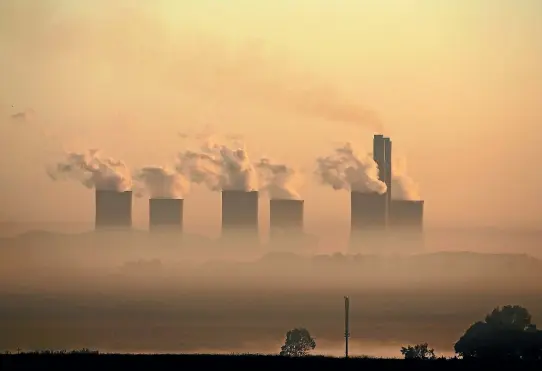  ?? PHOTO: REUTERS ?? Steam rises at sunrise from a coal-burning power station owned by state power utility ESKOM near Sasolburg, South Africa. A new study says such plants must be shut down by 2050 to prevent accelerate­d sealevel rises.