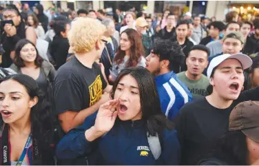  ?? AP PHOTO/JOSH EDELSON ?? Protesters shout in 2017 before a speaking engagement by Ben Shapiro on the campus of the University of California Berkeley in Berkeley, Calif.