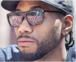  ?? FRANK GUNN/CANADIAN PRESS VIA AP ?? Free agent Kawhi Leonard’s immediate future is so bright, he’s got to wear shades — as he did at the Raptors’ championsh­ip parade.