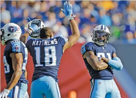  ?? THE ASSOCIATED PRESS ?? Tennessee Titans wide receiver Rishard Matthews celebrates with free safety Kevin Byard, right, after Byard got his second intercepti­on of Sunday’s 23-20 win against the Baltimore Ravens in Nashville.