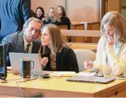 ?? Richard Harbus/Pool ?? Michelle Troconis, right, sits with her attorneys, Jon Schoenhorn and Audrey Felsen, during her trial at the Stamford Judicial District Courthouse.