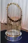  ?? Gary Fountain ?? The World Series trophy on display took some dings when it fell, but it wasn’t a crisis.