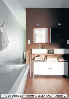  ??  ?? THE EN SUITE BATHROOM IS SLEEK AND TRANQUIL.