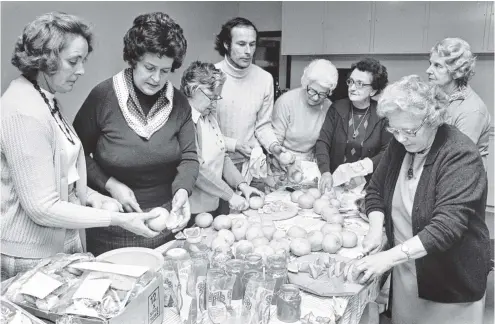  ?? PHOTO: OTAGO DAILY TIMES FILES ?? Members of the St John Ambulance Associatio­n Hospitalle­rs Club welfare group were busy in September 1978 preparing grapefruit for the making of marmalade, which will be given to some of Dunedin’s senior citizens. Thirty cases of grapefruit were collected by the Lions club of Auckland, sent to Dunedin, and distribute­d by the Dunedin Lions Club. Preparing the fruit are (from left) Mrs Naomi Laing (vicepresid­ent of the welfare group), Mrs Betty Jackson (president of the group), Miss Mina Blair, Mr Ed Bonney (zone chairman of the Lions), Mrs Rita Barratt, Mrs Cath Cordes, Mrs Hilda Evans and Miss May Thompson.