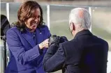  ?? Jonathan Ernst / AFP via Getty Images ?? Vice President Kamala Harris bumps fists with Biden after taking her oath.
