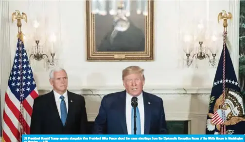  ?? — AFP ?? US President Donald Trump speaks alongside Vice President Mike Pence about the mass shootings from the Diplomatic Reception Room of the White House in Washington on Monday.