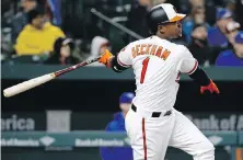  ??  ?? Orioles slugger Tim Beckham watches his sacrifice fly soar during the fourth inning against the Jays.