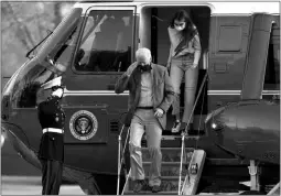  ?? MANUEL BALCE CENETA / ASSOCIATED PRESS ?? President Joe Biden and his granddaugh­ter Natalie Biden disembark Marine One on Sunday at the White House.