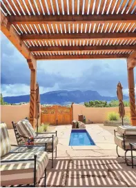  ?? COURTESY OF J. MACKENZIE ?? Shifting Moods & Views Garden, Tierra Madre: Joann and Scott MacKenzie’s landscapin­g emphasizes simplicity, dog friendline­ss, soothing water sounds, views of the Sandia Mountains, shaded backyard entertainm­ent space and flagstone pathways.