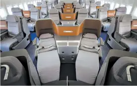  ?? BENJAMIN KILB FOR THE NEW YORK TIMES ?? Lufthansa has placed business-class seat pairs in a V-shape to save space.