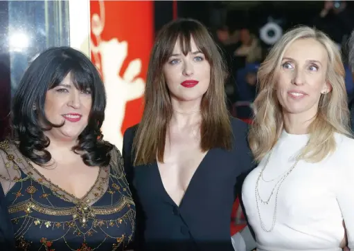  ??  ?? WOMEN IN LOVE: Author E L James, left, leading actress Dakota Johnson, centre, and director Sam Taylor-Johnson arrive for the screening of the movie
at the 65th Internatio­nal Film Festival in Berlin. Below, Taylor-Johnson with husband Aaron...