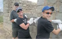  ??  ?? Steve, Lynda and Mitch Kurylowicz work side-by-side at the build site in the Maasai Mara.