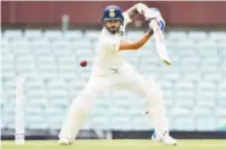  ?? Agence France-presse ?? India’s batsman Virat Kohli plays a shot on the second day of the tour match against Cricket Australia XI at the SCG in Sydney on Thursday.