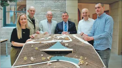  ?? 06_a26restpla­ns01 ?? Douglas Anderson and John Cleland, centre, flanked by Fiona Sichi, Gary Kennedy, Chris Twaddle and Ibai Ortuzar from Kennedy Twaddle with a 1:100 scale model of the proposed visitors’ centre.