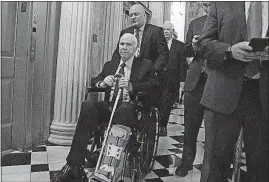  ?? APPLEWHITE/THE ASSOCIATED PRESS] [J. SCOTT ?? Sen. John McCain, R-Ariz., has begun using a wheelchair and also is wearing a walking boot after a slight tear in a right Achilles tendon.