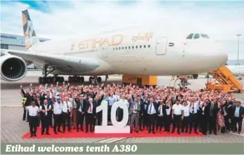  ?? Courtesy: Etihad ?? Etihad Airways and Airbus employees celebrate the handover of the airline’s tenth and final Airbus A380 at the European planemaker’s Hamburg Finkenwerd­er plant in Germany. The aircraft was officially handed over to Etihad yesterday before it took off...