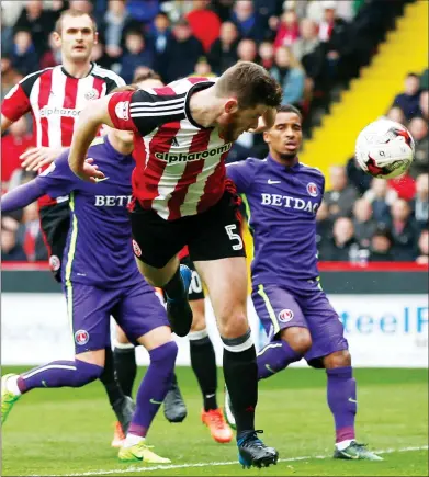 ??  ?? STOOP TO CONQUER: Jack O’Connell starts the fightback with Sheffield United’s equalising goal