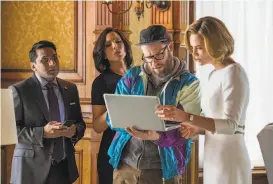  ?? Philippe Bossé / Lionsgate Films ?? Ravi Patel, June Diane Raphael, Seth Rogen and Charlize Theron in “Long Shot,” where speechwrit­er Rogen works for and courts candidate Theron.