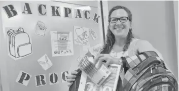  ?? [ALI WILSON / THE OBSERVER] ?? Tina Reed, coordinato­r of community support with Woolwich Community Services, is asking for donations to help fill 125 backpacks for local families in need ahead of the launch of the program at the end of August.