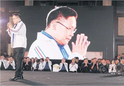  ?? APICHIT JINAKUL ?? Palang Pracharath Party leader and Industry Minister Uttama Savanayana gives a wai during the party’s Nov 18 meeting in Bangkok, which was attended by many politician­s who have defected from other parties.