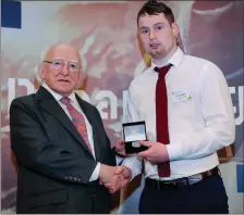  ??  ?? Gary Costello receiving his Gold Gaisce award from President