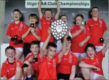  ??  ?? Kilmactran­ny boys celebrate winning the 2- teacher 5- aside.