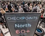  ?? JOHN SPINK/ATLANTA JOURNAL-CONSTITUTI­ON ?? Travelers at Atlanta’s Hartsfield-Jackson Internatio­nal Airport endured long lines on Monday.