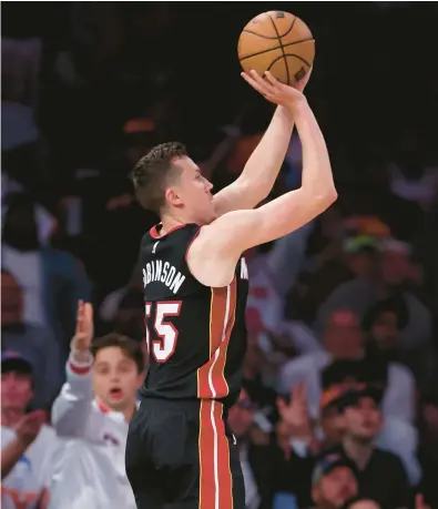  ?? ELSA/GETTY ?? The Heat’s Duncan Robinson shoots a 3-pointer against the Knicks during Game 5 of the Eastern Conference semifinals at Madison Square Garden in New York.