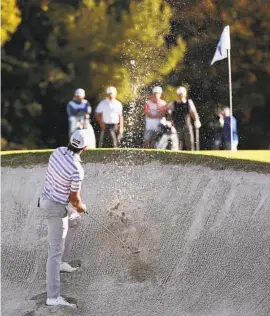  ?? RYAN KANG AP ?? Max Homa hits from a bunker to the 12th green during the second round of the Genesis Invitation­al. Homa leads the tournament by one stroke over three others.