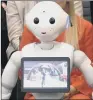  ??  ?? ROBOT FIRST: Pepper answering questions before MPs in the House of Commons.