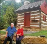  ?? BILL RETTEW JR. — DIGITAL FIRST MEDIA ?? Supervisor­s Joe Toner, left, and Patricia D. Gaines pose in front of the log house in Uwchlan Township that they both had a hand in preserving.