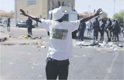  ?? Pictures: Tracy Lee Stark ?? TENSION. Residents in Westbury blocked roads into the area yesterday after running battles with police following the killing of a woman last week in an alleged gang-related incident. The community are demanding a meeting with Police Minister Bheki Cele.