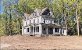  ?? Photos by Joel Bisaillon ?? Joel Bisaillon renovated the historic structure at 2421 Troy-schenectad­y Road, at left, and will soon have its neighbor at 2627 on the market.