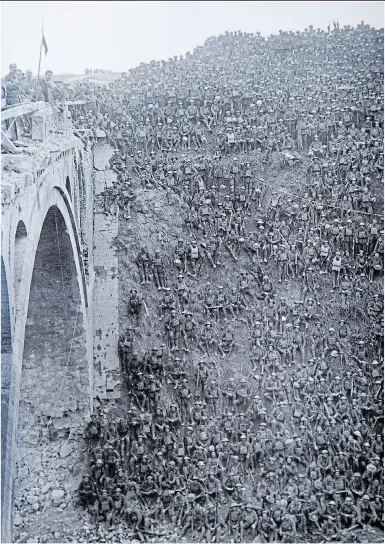  ??  ?? Troops following victory at the St Quentin canal bridge which was part of the 100 Days Offensive that came in the wake of the Battle of Amiens